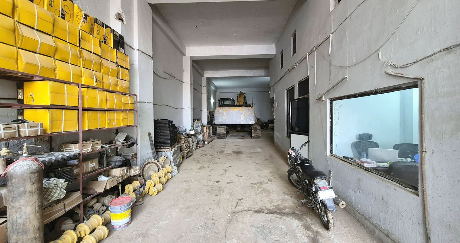 Inside the TerraMax yard with an excavator at the back